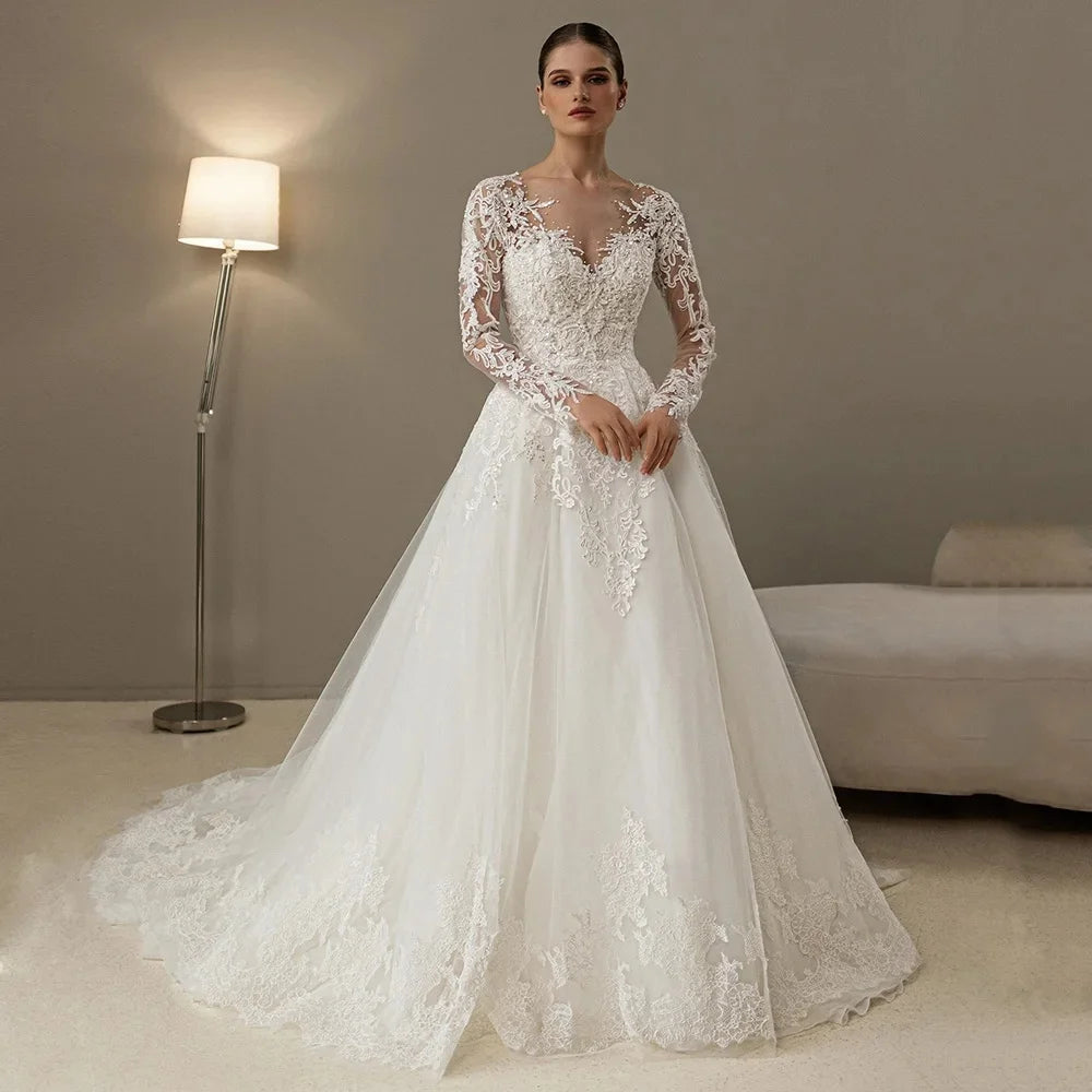 Effortlessly enchantingLong Sleeves Vestidos De Novia Sheer Scoop Neck Pearls Beading Lace